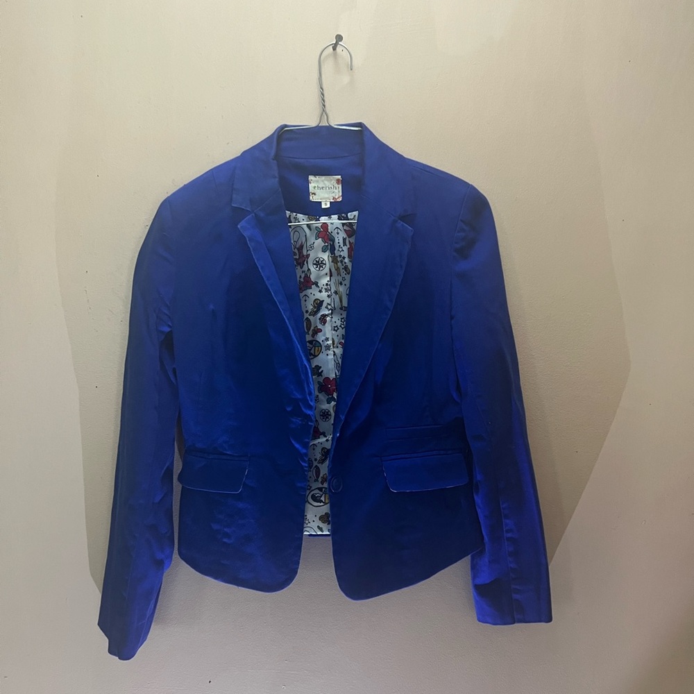 Woman size small blue blazer with designs